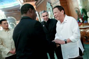 President Rodrigo Roa Duterte shares a light moment with a member of the delegation of outgoing Apostolic Nuncio of the Holy See to the Philippines Archbishop Gabriele Caccia, who paid a farewell call to the President at the Malacañan Palace on December 11, 2019. ROBINSON NIÑAL JR./PRESIDENTIAL PHOTO