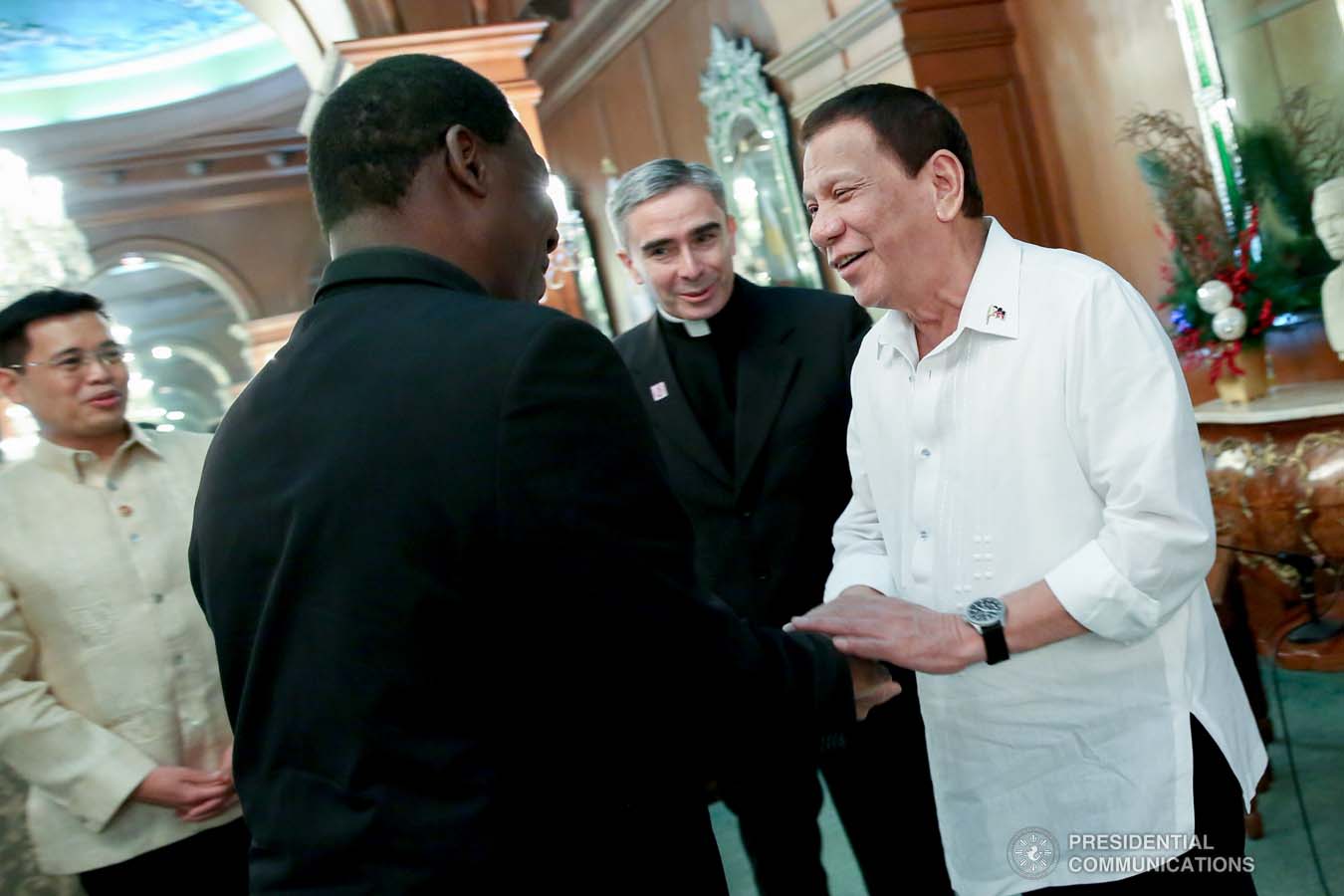 President Rodrigo Roa Duterte shares a light moment with a member of the delegation of outgoing Apostolic Nuncio of the Holy See to the Philippines Archbishop Gabriele Caccia, who paid a farewell call to the President at the Malacañan Palace on December 11, 2019. ROBINSON NIÑAL JR./PRESIDENTIAL PHOTO