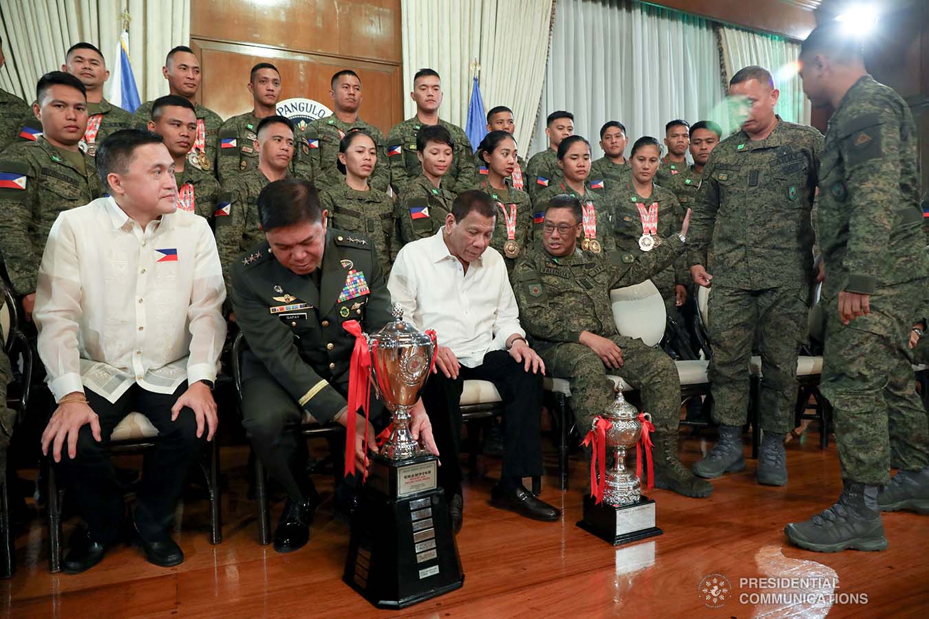 President Rodrigo Roa Duterte looks at the trophy won by the Philippine Army Team in the ASEAN Armies Rifle Meet 2019 held recently in Indonesia. The President met the team at the Malacañan Palace on December 9, 2019. ROBINSON NIÑAL JR./PRESIDENTIAL PHOTO