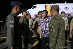 President Rodrigo Roa Duterte is welcomed by military officers upon his arrival at the Legazpi City Airport before heading to the Legazpi City Convention Center for the situation briefing on the effects of Typhoon Tisoy on December 5, 2019. ROBINSON NIÑAL JR./PRESIDENTIAL PHOTO