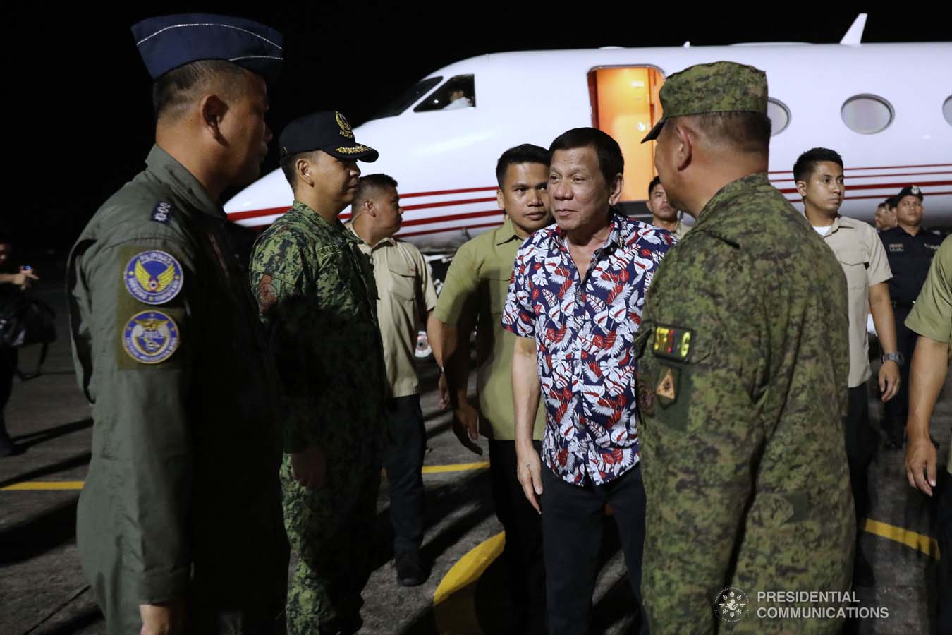 President Rodrigo Roa Duterte is welcomed by military officers upon his arrival at the Legazpi City Airport before heading to the Legazpi City Convention Center for the situation briefing on the effects of Typhoon Tisoy on December 5, 2019. ROBINSON NIÑAL JR./PRESIDENTIAL PHOTO