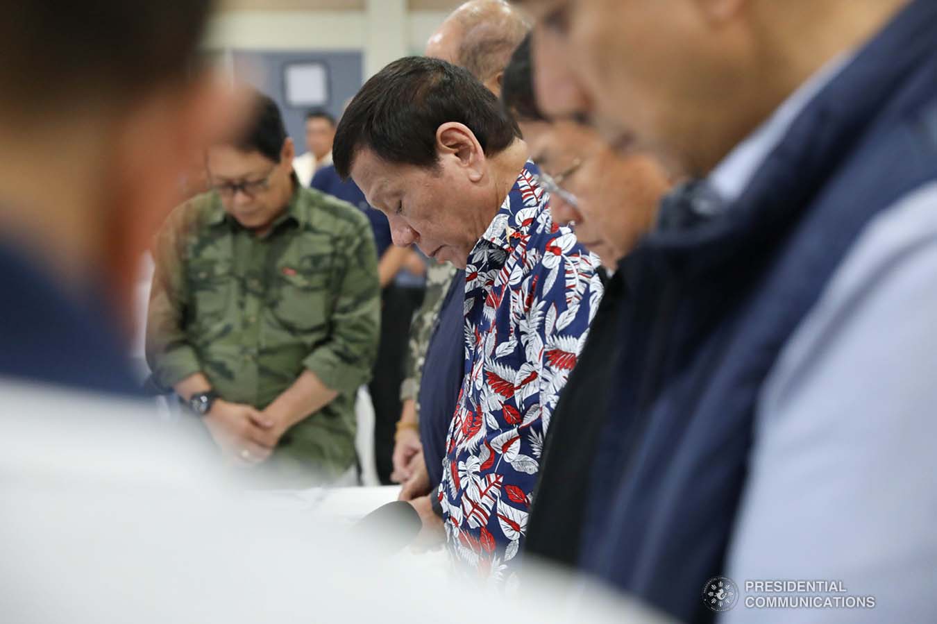President Rodrigo Roa Duterte bows his head in prayer prior to the start of the situation briefing on the effects of Typhoon Tisoy at the Legazpi City Convention Center on December 5, 2019. ROBINSON NIÑAL JR./PRESIDENTIAL PHOTO