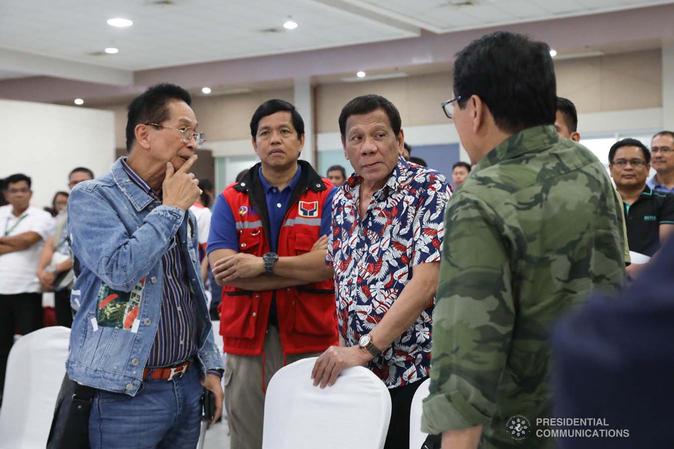 President Rodrigo Roa Duterte discusses matters with Presidential Chief Legal Counsel and Spokesperson Salvador Panelo, Social Welfare and Development Secretary Rolando Bautista and Labor and Employment Secretary Silvestre Bello III during the situation briefing on the effects of Typhoon Tisoy at the Legazpi City Convention Center on December 5, 2019. ROBINSON NIÑAL JR./PRESIDENTIAL PHOTO