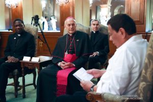 President Rodrigo Roa Duterte reads a document during the farewell call of outgoing Apostolic Nuncio of the Holy See to the Philippines Archbishop Gabriele Caccia at the Malacañan Palace on December 11, 2019. ROBINSON NIÑAL JR./PRESIDENTIAL PHOTO