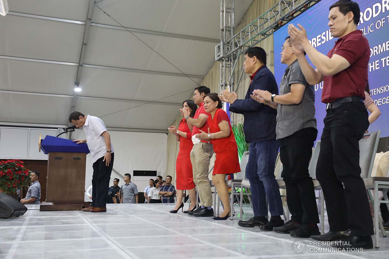 President Rodrigo Roa Duterte takes a bow before the guests during the inauguration of The Tent at Vista Global South and the birthday celebration former Senate President Manuel Villar in Las Piñas City on December 12, 2019. SIMEON CELI JR./PRESIDENTIAL PHOTO
