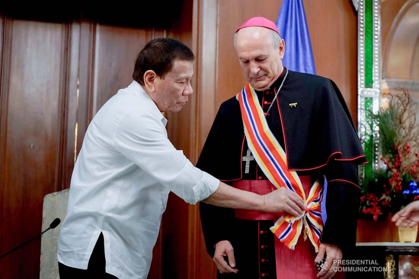 President Rodrigo Roa Duterte confers the Order of Sikatuna with the Rank of Datu on outgoing Apostolic Nuncio of the Holy See to the Philippines Archbishop Gabriele Caccia during his farewell call to the President at the Malacañan Palace on December 11, 2019. KING RODRIGUEZ/PRESIDENTIAL PHOTO