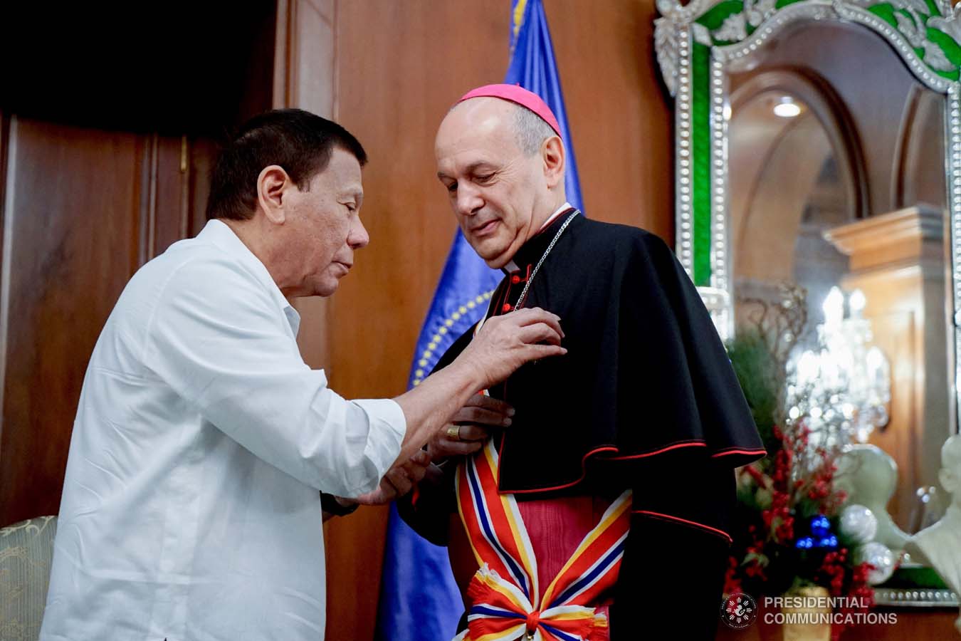 President Rodrigo Roa Duterte confers the Order of Sikatuna with the Rank of Datu on outgoing Apostolic Nuncio of the Holy See to the Philippines Archbishop Gabriele Caccia during his farewell call to the President at the Malacañan Palace on December 11, 2019. KING RODRIGUEZ/PRESIDENTIAL PHOTO