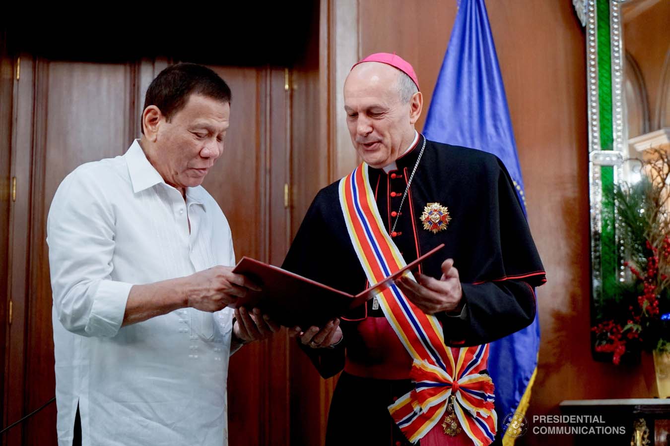 President Rodrigo Roa Duterte confers the Order of Sikatuna with the Rank of Datu on outgoing Apostolic Nuncio of the Holy See to the Philippines Archbishop Gabriele Caccia during his farewell call to the President at the Malacañan Palace on December 11, 2019. KING RODRIGUEZ/PRESIDENTIAL PHOTO