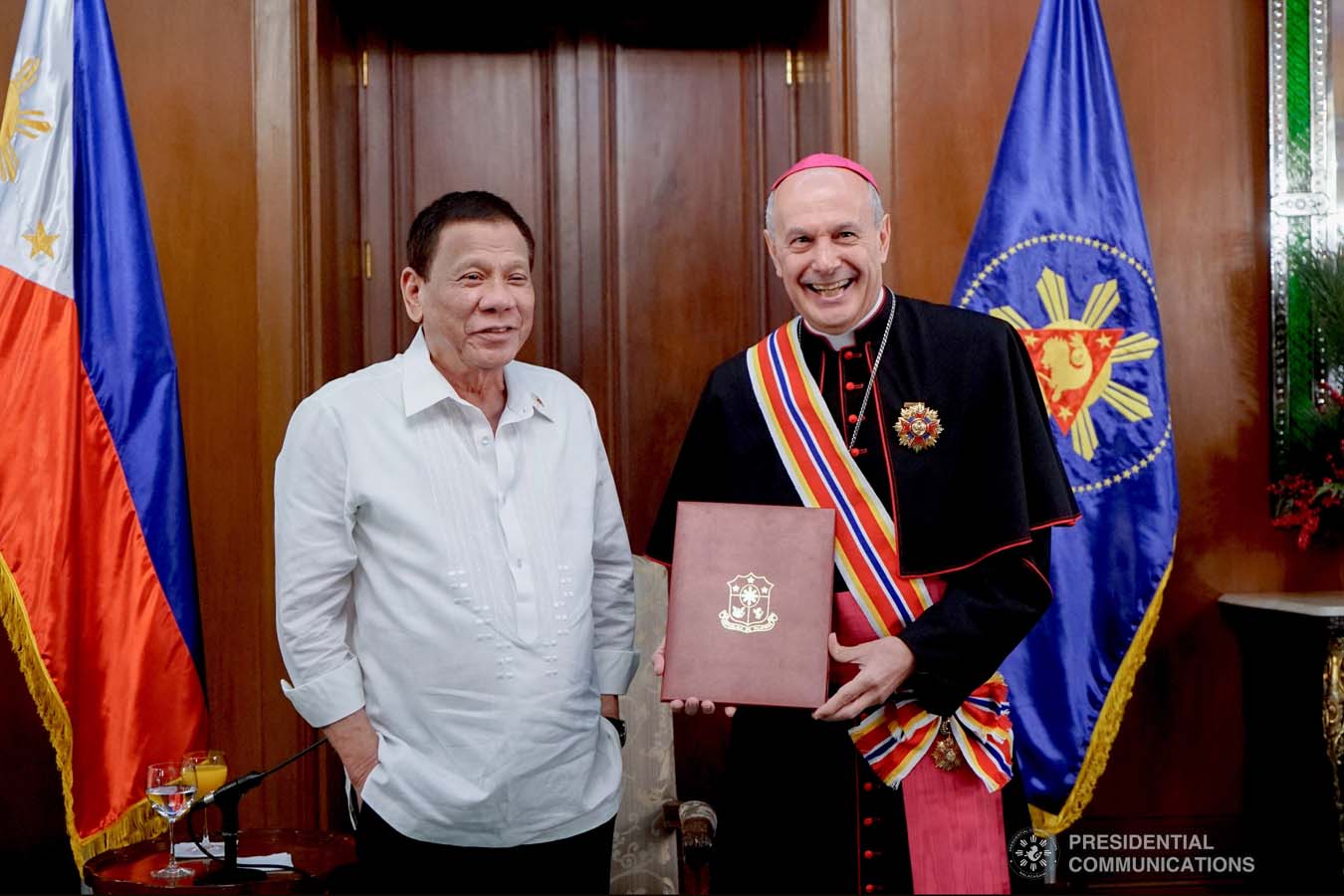 President Rodrigo Roa Duterte confers the Order of Sikatuna with the Rank of Datu on outgoing Apostolic Nuncio of the Holy See to the Philippines Archbishop Gabriele Caccia during his farewell call to the President at the Malacañan Palace on December 11, 2019. KING RODRIGUEZ/PRESIDENTIAL PHOTO