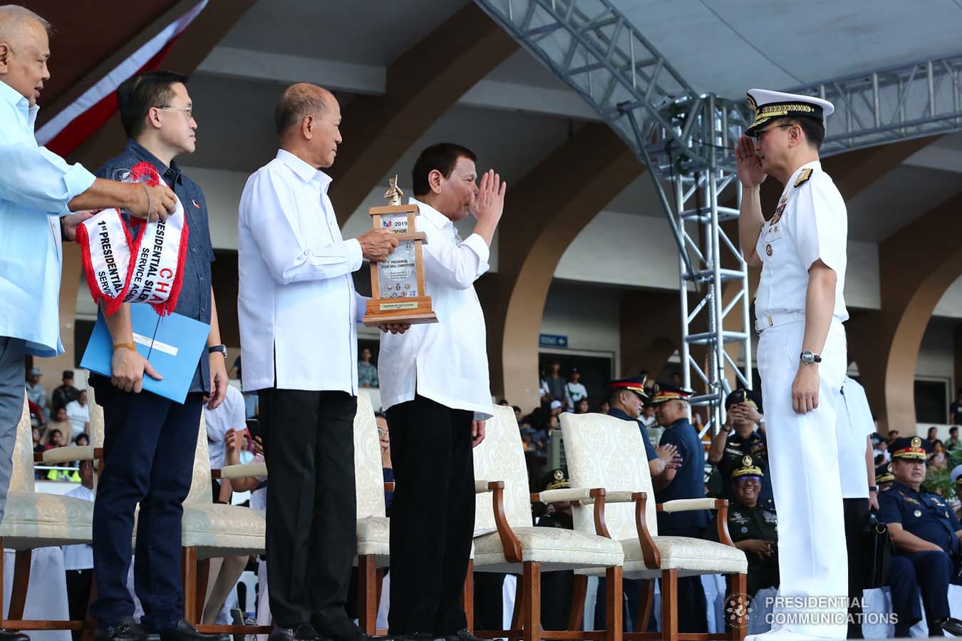 President Rodrigo Roa Duterte salutes one of the winners during the 1st Presidential Silent Drill Competition at the Quirino Grandstand in Manila on December 20, 2019. REY BANIQUET/PRESIDENTIAL PHOTO