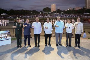 President Rodrigo Roa Duterte strikes his signature pose with Armed Forces of the Philippines Chief of Staff General Noel Clement, Senator Christopher "Bong" Go, Defense Secretary Delfin Lorenzana, Executive Secretary Salvador Medialdea, Interior and Local Government Secretary Eduardo Año and Manila City Mayor Francisco Domagoso during the National Reserve Officers' Training Corps (ROTC) Summit and the 1st Presidential Silent Drill Competition at the Quirino Grandstand in Manila on December 20, 2019. REY BANIQUET/PRESIDENTIAL PHOTO