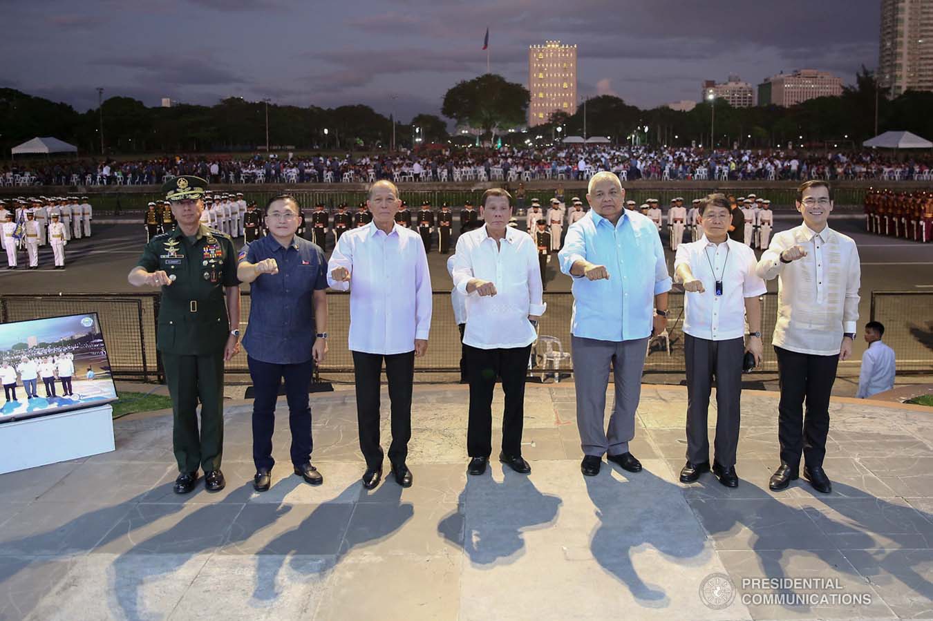 President Rodrigo Roa Duterte strikes his signature pose with Armed Forces of the Philippines Chief of Staff General Noel Clement, Senator Christopher "Bong" Go, Defense Secretary Delfin Lorenzana, Executive Secretary Salvador Medialdea, Interior and Local Government Secretary Eduardo Año and Manila City Mayor Francisco Domagoso during the National Reserve Officers' Training Corps (ROTC) Summit and the 1st Presidential Silent Drill Competition at the Quirino Grandstand in Manila on December 20, 2019. REY BANIQUET/PRESIDENTIAL PHOTO