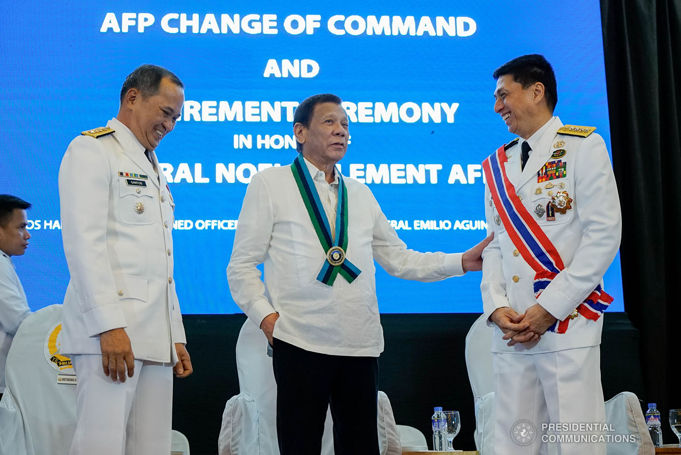 President Rodrigo Roa Duterte shares a light moment with Armed Forces of the Philippines (AFP) Chief of Staff Lieutenant General Felimon Santos and outgoing AFP Chief of Staff General Noel Clement during the AFP Change of Command ceremony at Camp General Emilio Aguinaldo in Quezon City on January 4, 2020. KING RODRIGUEZ/PRESIDENTIAL PHOTO