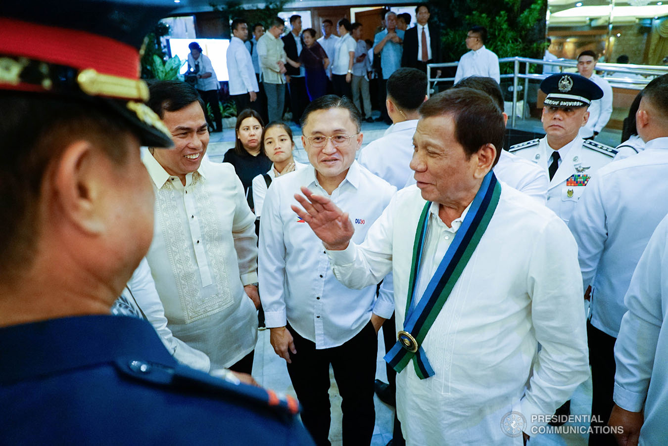 President Rodrigo Roa Duterte shares a light moment with some of the guests during the Armed Forces of the Philippines (AFP) Change of Command ceremony at Camp General Emilio Aguinaldo in Quezon City on January 4, 2020. KING RODRIGUEZ/PRESIDENTIAL PHOTO