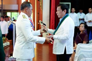 President Rodrigo Roa Duterte hands over the Armed Forces of the Philippines (AFP) Command Saber to newly installed AFP Chief of Staff Lieutenant General Felimon Santos during the AFP Change of Command ceremony at Camp General Emilio Aguinaldo in Quezon City on January 4, 2020. REY BANIQUET/PRESIDENTIAL PHOTO
