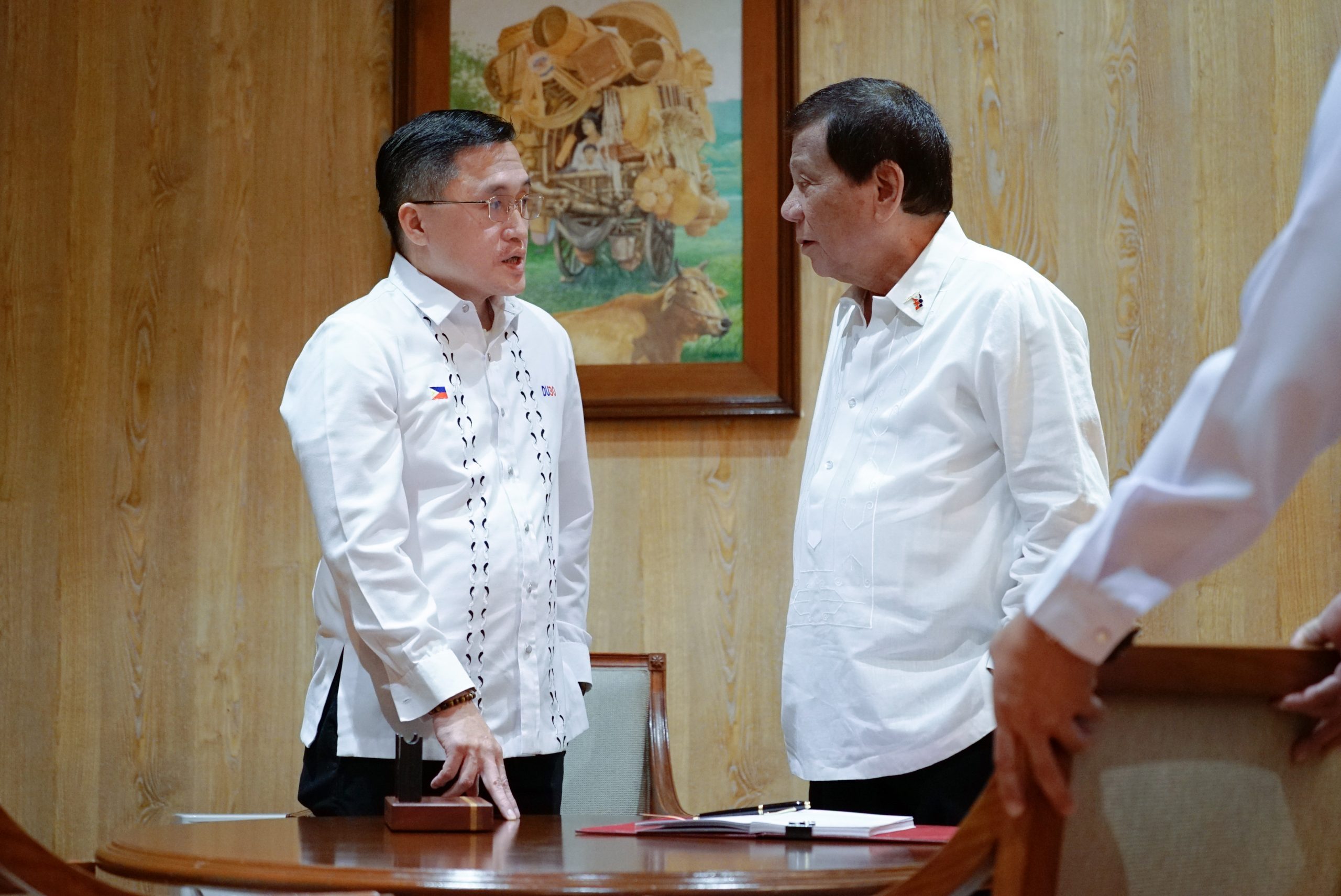 President Rodrigo Roa Duterte chats with Senator Christopher "Bong" Go after signing the Salary Standardization Law of 2019 at the Malacañan Palace on January 8, 2020. KING RODRIGUEZ/PRESIDENTIAL PHOTO