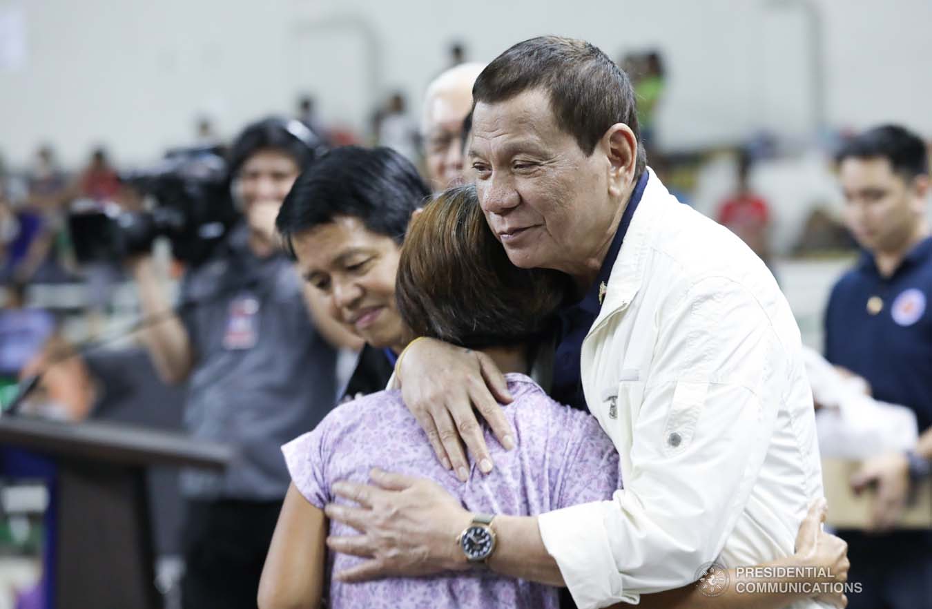 President Rodrigo Roa Duterte embraces one of the victims affected by the Taal Volcano eruption during his visit at the Batangas City Sports Coliseum on January 14, 2020. ACE MORANDANTE/PRESIDENTIAL PHOTO