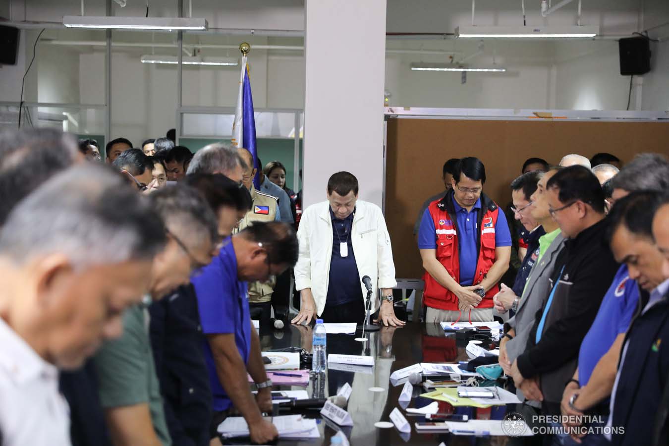 President Rodrigo Roa Duterte bows his head in prayer before holding a situation briefing on the effects of the Taal Volcano eruption at the Batangas Provincial Sports Complex on January 14, 2020. VALERIE ESCALERA/PRESIDENTIAL PHOTO