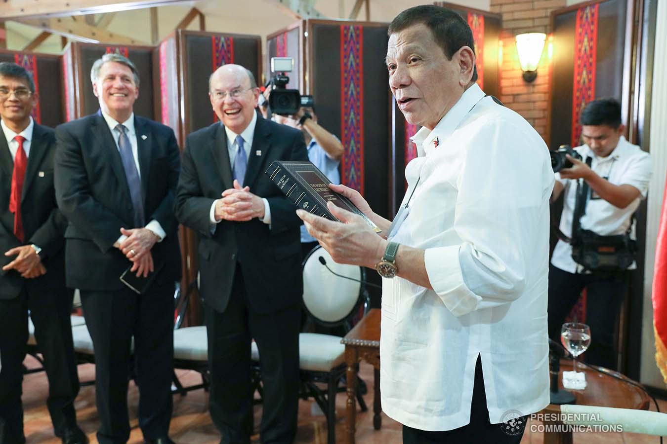 President Rodrigo Roa Duterte receives a copy of the Book of Mormon from the officials of the Church of Jesus Christ of Latter-Day Saints who paid a courtesy call on the President at the Malago Clubhouse in Manila on January 15, 2020. ACE MORANDANTE/PRESIDENTIAL PHOTO