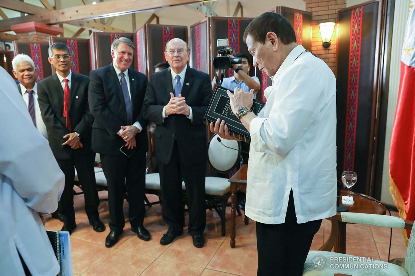 President Rodrigo Roa Duterte receives a copy of the Book of Mormon during the courtesy call of the officials of the Church of Jesus Christ of Latter-Day Saints at the Malago Clubhouse in Manila on January 15, 2020. ACE MORANDANTE/PRESIDENTIAL PHOTO