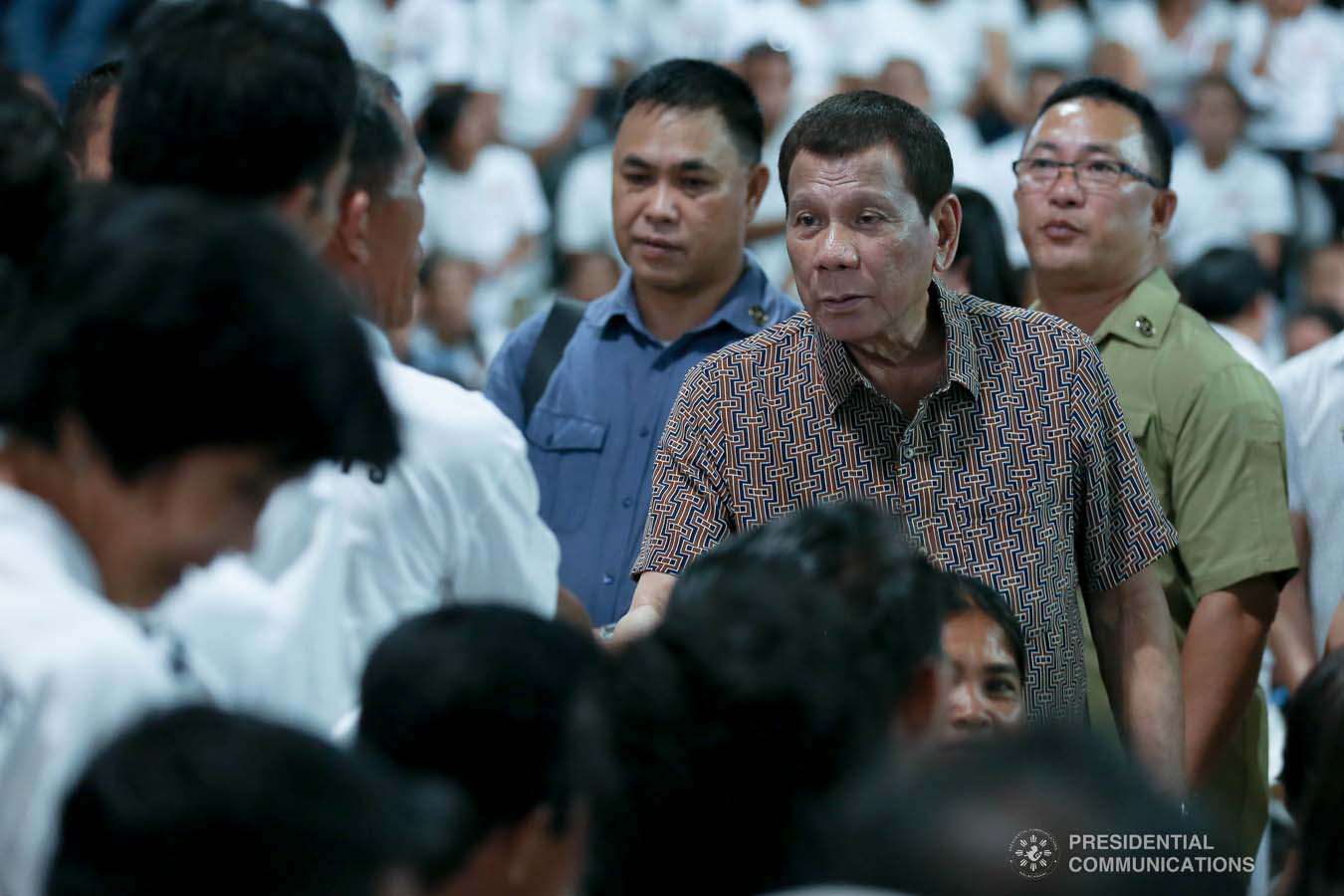 President Rodrigo Roa Duterte greets former rebels before distributing their benefits during a ceremony at the San Isidro Central School in Leyte on January 23, 2020. KARL NORMAN ALONZO/PRESIDENTIAL PHOTO
