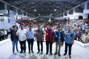 President Rodrigo Roa Duterte strikes his signature pose with Presidential Assistant for the Visayas Michael Dino, Agrarian Reform Secretary John Castriciones, Leyte Governor Leopoldo Petilla, Social Welfare and Development Secretary Rolando Bautista, Interior and Local Government Secretary Eduardo Año and Senator Christopher "Bong" Go during the distribution of benefits to former rebels at the San Isidro Central School in Leyte on January 23, 2020. KARL NORMAN ALONZO/PRESIDENTIAL PHOTO