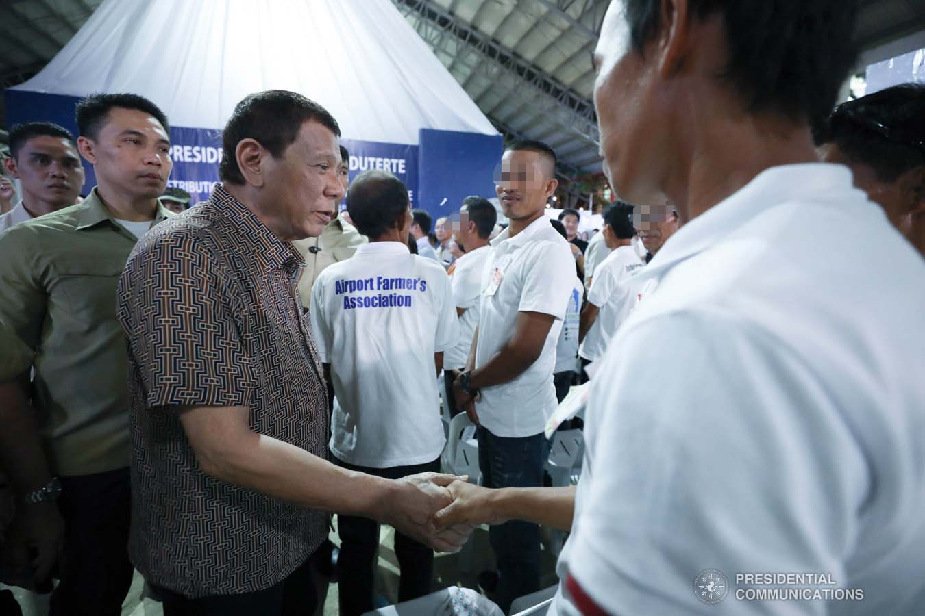 President Rodrigo Roa Duterte greets former rebels before distributing their benefits during a ceremony at the San Isidro Central School in Leyte on January 23, 2020. KARL NORMAN ALONZO/PRESIDENTIAL PHOTO