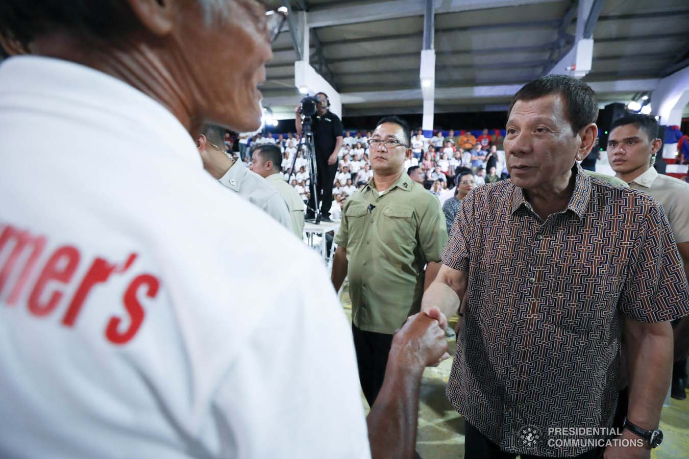 President Rodrigo Roa Duterte greets former rebels before distributing their benefits during a ceremony at the San Isidro Central School in Leyte on January 23, 2020. KARL NORMAN ALONZO/PRESIDENTIAL PHOTO