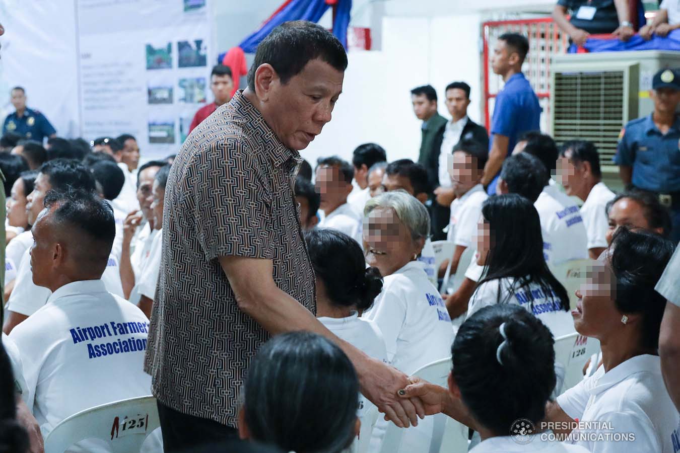 President Rodrigo Roa Duterte greets former rebels before distributing their benefits during a ceremony at the San Isidro Central School in Leyte on January 23, 2020. VALERIE ESCALERA/PRESIDENTIAL PHOTO