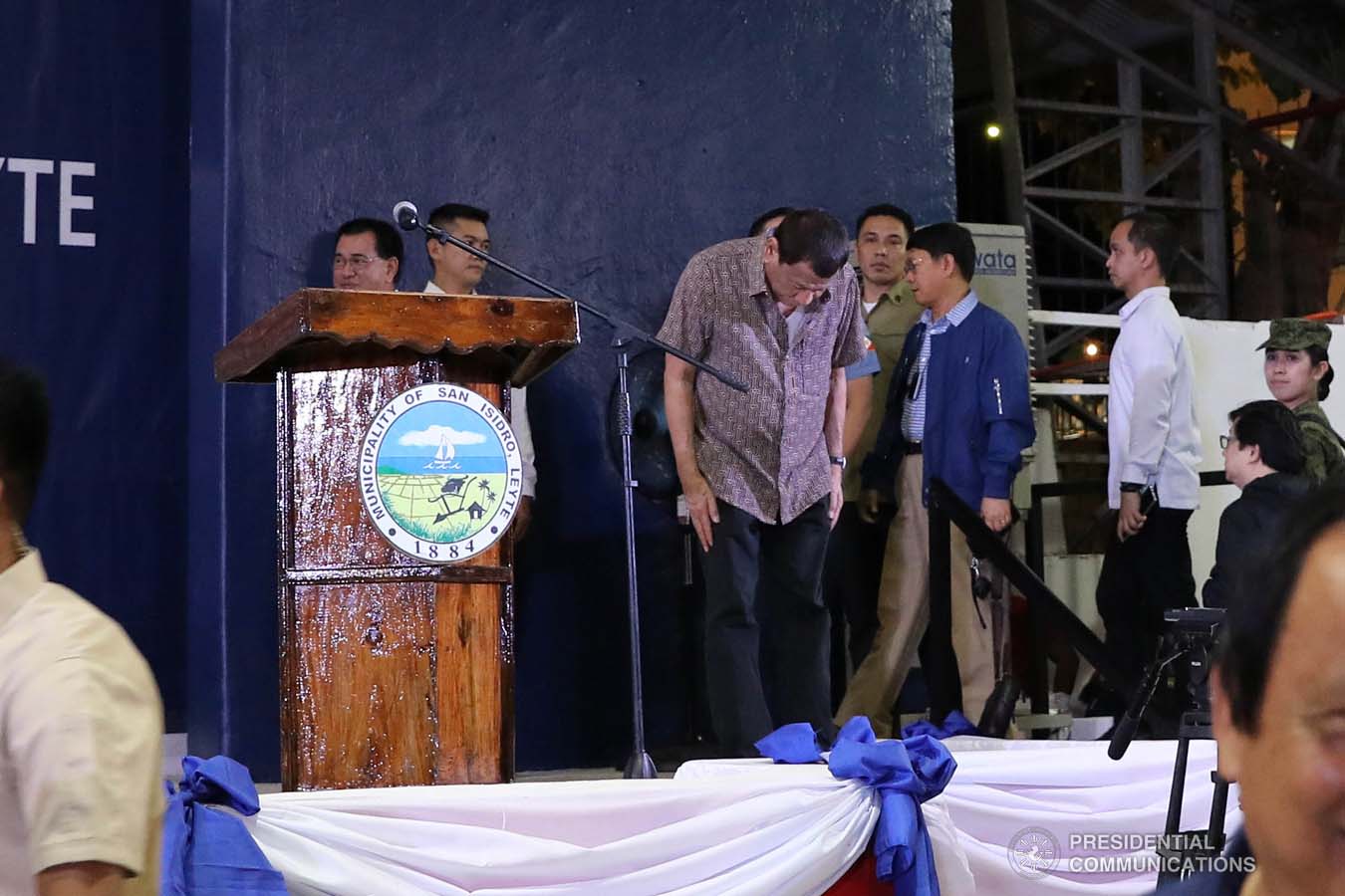 President Rodrigo Roa Duterte takes a bow before former rebels before distributing their benefits during a ceremony at the San Isidro Central School in Leyte on January 23, 2020. VALERIE ESCALERA/PRESIDENTIAL PHOTO