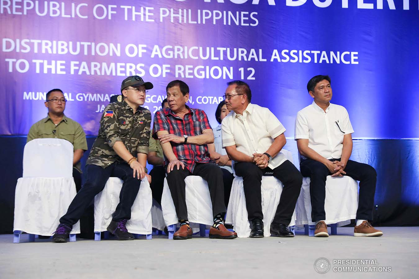 President Rodrigo Roa Duterte chats with Senator Christopher "Bong" Go during the ceremonial distribution of agricultural assistance to the farmers of Region 12 at the Pigcawayan Municipal Gymnasium in Cotabato on January 10, 2020. ROBINSON NIÑAL JR./PRESIDENTIAL PHOTO