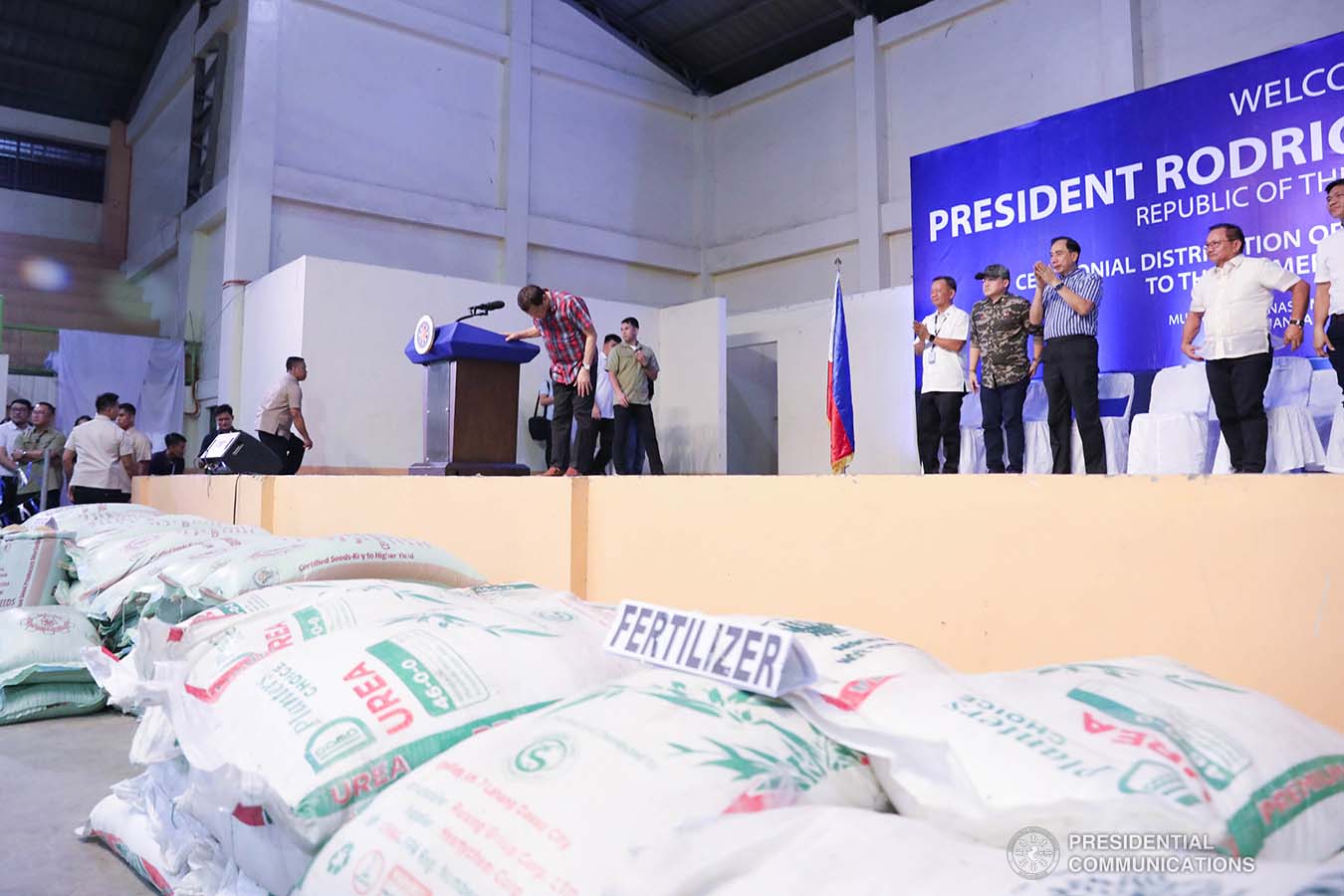 President Rodrigo Roa Duterte takes a bow after delivering a speech during the ceremonial distribution of agricultural assistance to the farmers of Region 12 at the Pigcawayan Municipal Gymnasium in Cotabato on January 10, 2020. With the President are Senator Christopher "Bong" Go and Agriculture Secretary William Dar. ROBINSON NIÑAL JR./PRESIDENTIAL PHOTO