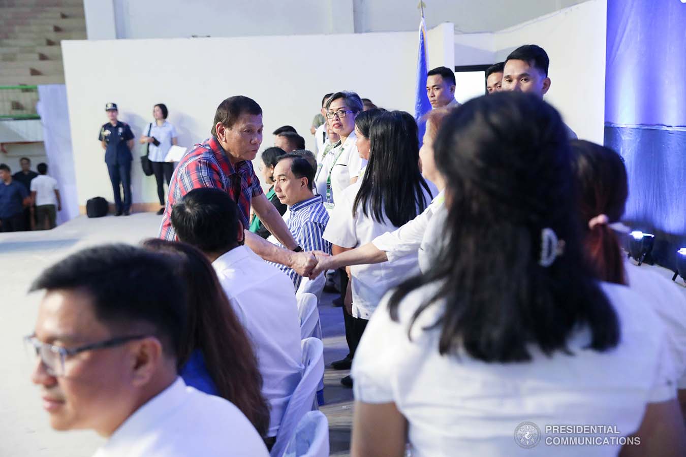 President Rodrigo Roa Duterte greets some of the guests during the ceremonial distribution of agricultural assistance to the farmers of Region 12 at the Pigcawayan Municipal Gymnasium in Cotabato on January 10, 2020. ROBINSON NIÑAL JR./PRESIDENTIAL PHOTO