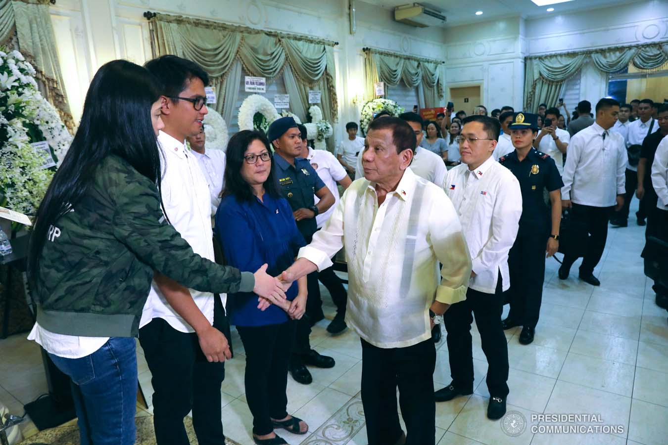 President Rodrigo Roa Duterte condoles with the family of the late Retired Police General Francisco Villaroman as he visited the wake at the Cosmopolitan Funeral Homes in Davao City on January 17, 2020. ROBINSON NIÑAL JR./PRESIDENTIAL PHOTO