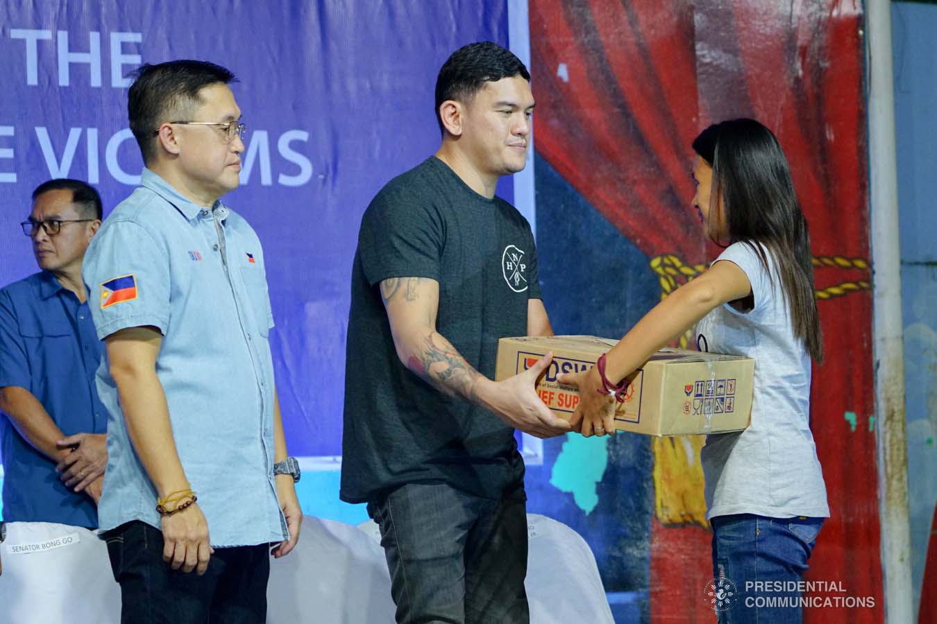 Davao City Vice Mayor Sebastian Duterte, who visited earthquake victims in Padada, Davao del Sur on behalf of his father President Rodrigo Roa Duterte, leads the ceremonial distribution of family food packs at the Padada Central Elementary School on January 3, 2020. Assisting the President's son is Senator Christopher "Bong" Go. JOEY DALUMPINES/PRESIDENTIAL PHOTO