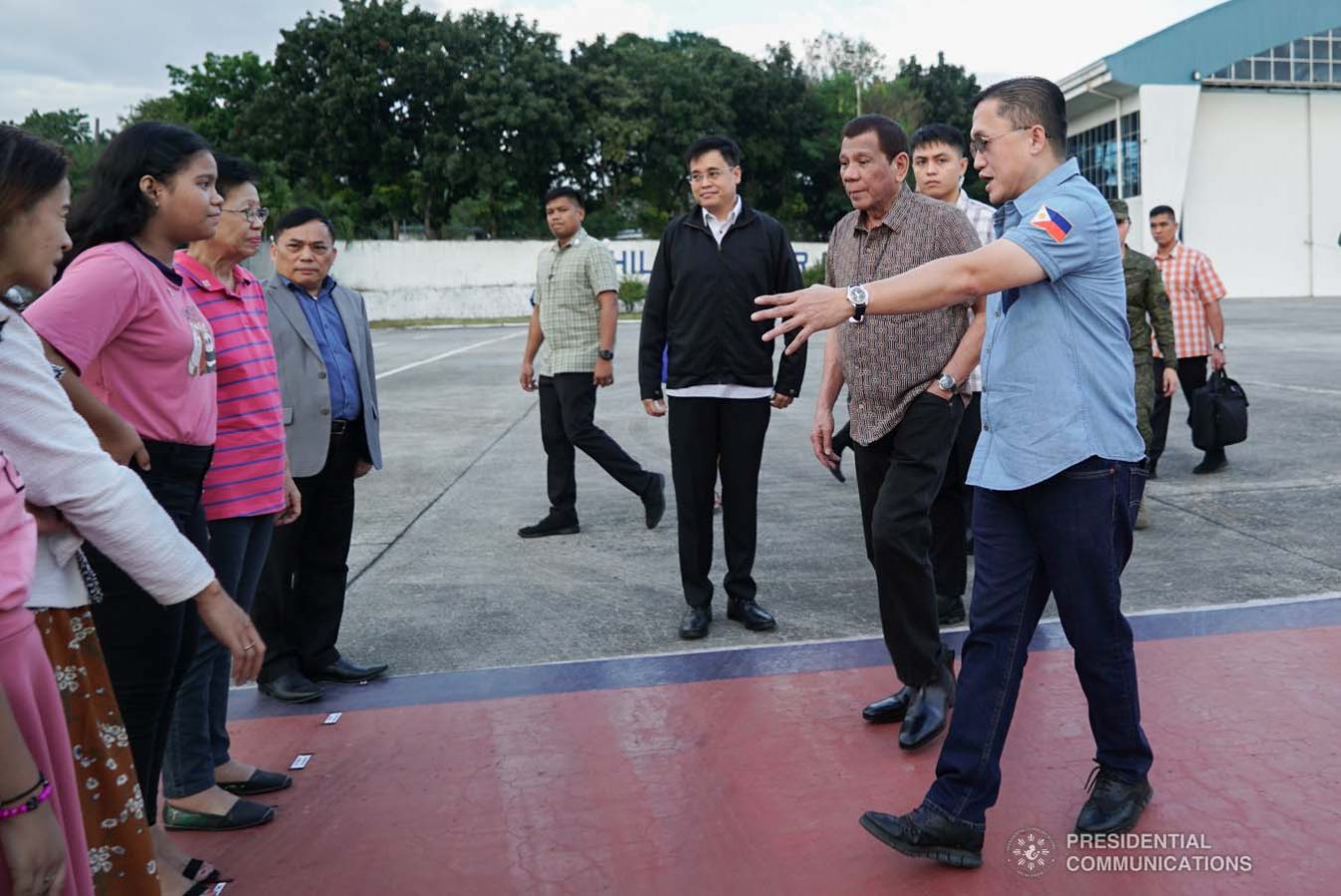 President Rodrigo Roa Duterte meets with the family of Overseas Filipino Worker (OFW) Roderick Aguinaldo, who is currently detained in Bahrain, as the President led their send-off at the Villamor Air Base in Pasay City on January 23, 2020. The family wil leave for Bahrain on Saturday. With the President is Senator Christopher "Bong" Go. KING RODRIGUEZ/PRESIDENTIAL PHOTO
