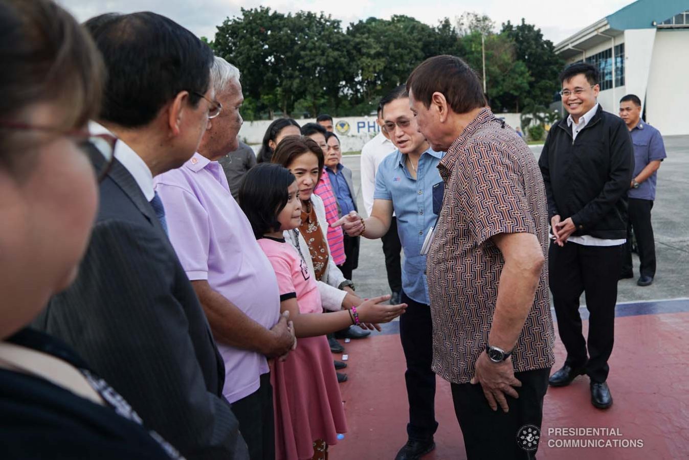 President Rodrigo Roa Duterte meets with the family of Overseas Filipino Worker (OFW) Roderick Aguinaldo, who is currently detained in Bahrain, as the President led their send-off at the Villamor Air Base in Pasay City on January 23, 2020. The family wil leave for Bahrain on Saturday. With the President is Senator Christopher "Bong" Go. KING RODRIGUEZ/PRESIDENTIAL PHOTO