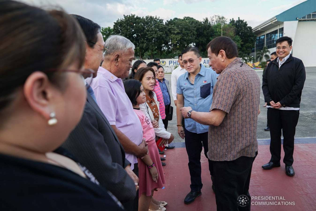 President Rodrigo Roa Duterte meets with the family of Overseas Filipino Worker (OFW) Roderick Aguinaldo, who is currently detained in Bahrain, as the President led their send-off at the Villamor Air Base in Pasay City on January 23, 2020. The family wil leave for Bahrain on Saturday. With the President is Senator Christopher "Bong" Go. KING RODRIGUEZ/PRESIDENTIAL PHOTO