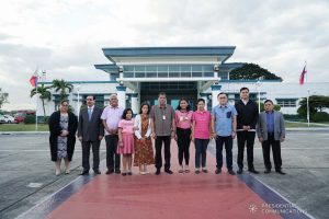 President Rodrigo Roa Duterte poses for posterity with the family of Overseas Filipino Worker (OFW) Roderick Aguinaldo, who is currently imprisoned in Bahrain, during the send-off at the Villamor Air Base in Pasay City on January 23, 2020. The family is set to visit the detained OFW on Saturday. With the President is Senator Christopher "Bong" Go. KING RODRIGUEZ/PRESIDENTIAL PHOTO