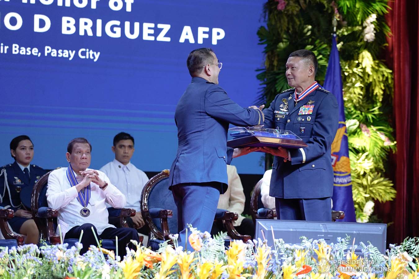 President Rodrigo Roa Duterte looks on as outgoing Philippine Air Force (PAF) Commanding General Lieutenant General Rozzano Briguez receives a command memento from incoming PAF Commanding General Major General Allen Paredes during the PAF Change of Command ceremony at the Col. Jesus Villamor Air Base in Pasay City on January 16, 2020. KING RODRIGUEZ/PRESIDENTIAL PHOTO