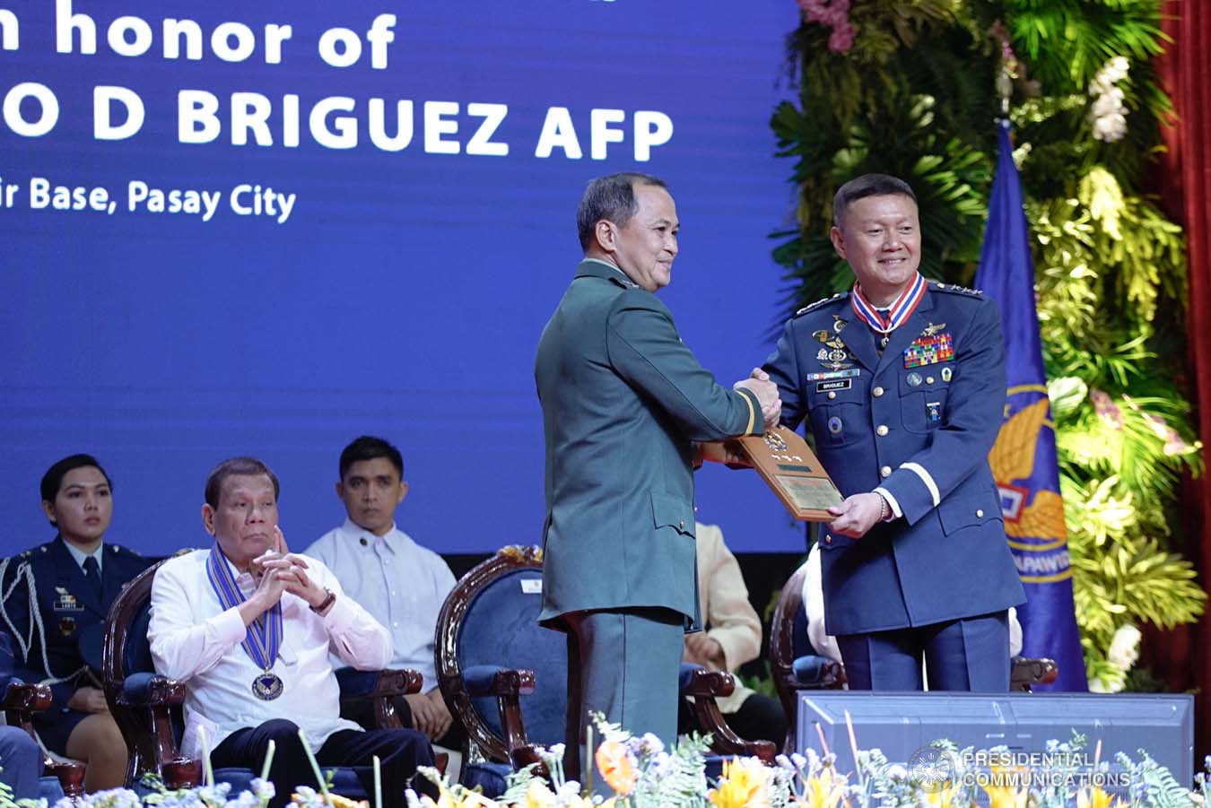 President Rodrigo Roa Duterte looks on as outgoing Philippine Air Force (PAF) Commanding General Lieutenant General Rozzano Briguez receives a command plaque from Armed Forces of the Philippines Chief of Staff Felimon Santos Jr. during the PAF Change of Command ceremony at the Col. Jesus Villamor Air Base in Pasay City on January 16, 2020. KING RODRIGUEZ/PRESIDENTIAL PHOTO