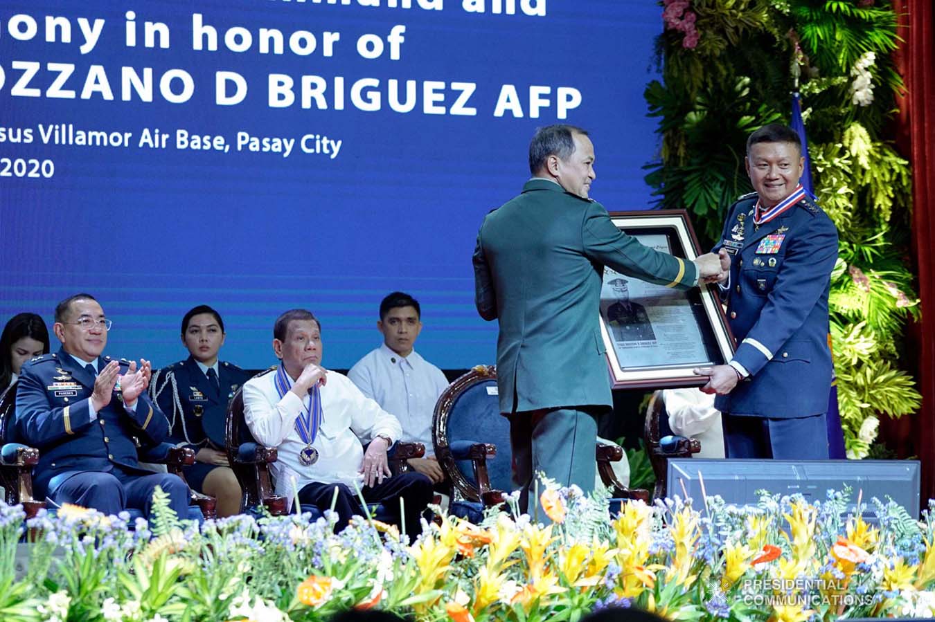 President Rodrigo Roa Duterte looks on as outgoing Philippine Air Force (PAF) Commanding General Lieutenant General Rozzano Briguez receives a command plaque from Armed Forces of the Philippines Chief of Staff Felimon Santos Jr. during the PAF Change of Command ceremony at the Col. Jesus Villamor Air Base in Pasay City on January 16, 2020. KING RODRIGUEZ/PRESIDENTIAL PHOTO