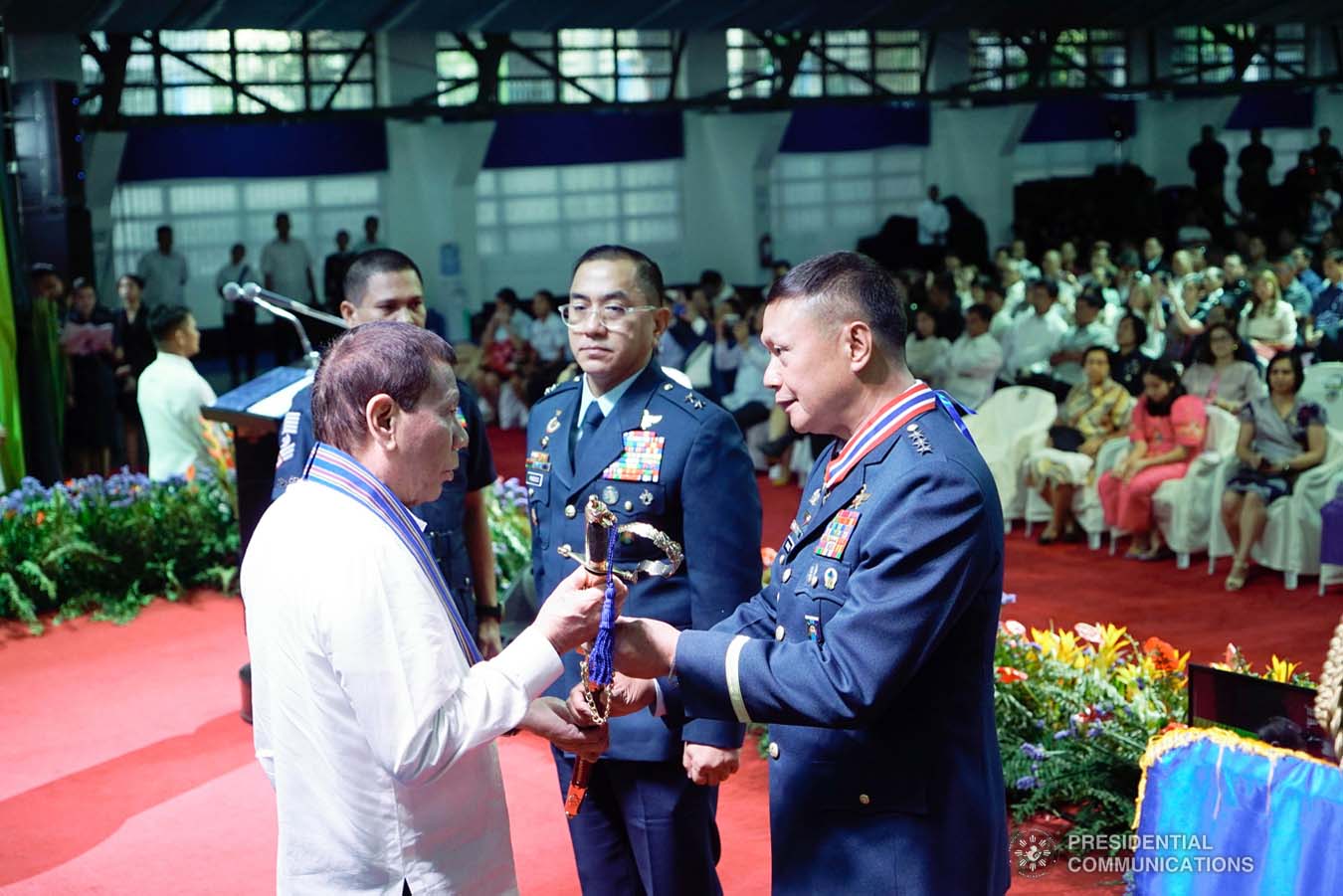 President Rodrigo Roa Duterte receives the command saber from outgoing Philippine Air Force (PAF) Commanding General Lieutenant General Rozzano Briguez during the PAF Change of Command ceremony at the Col. Jesus Villamor Air Base in Pasay City on January 16, 2020. KING RODRIGUEZ/PRESIDENTIAL PHOTO