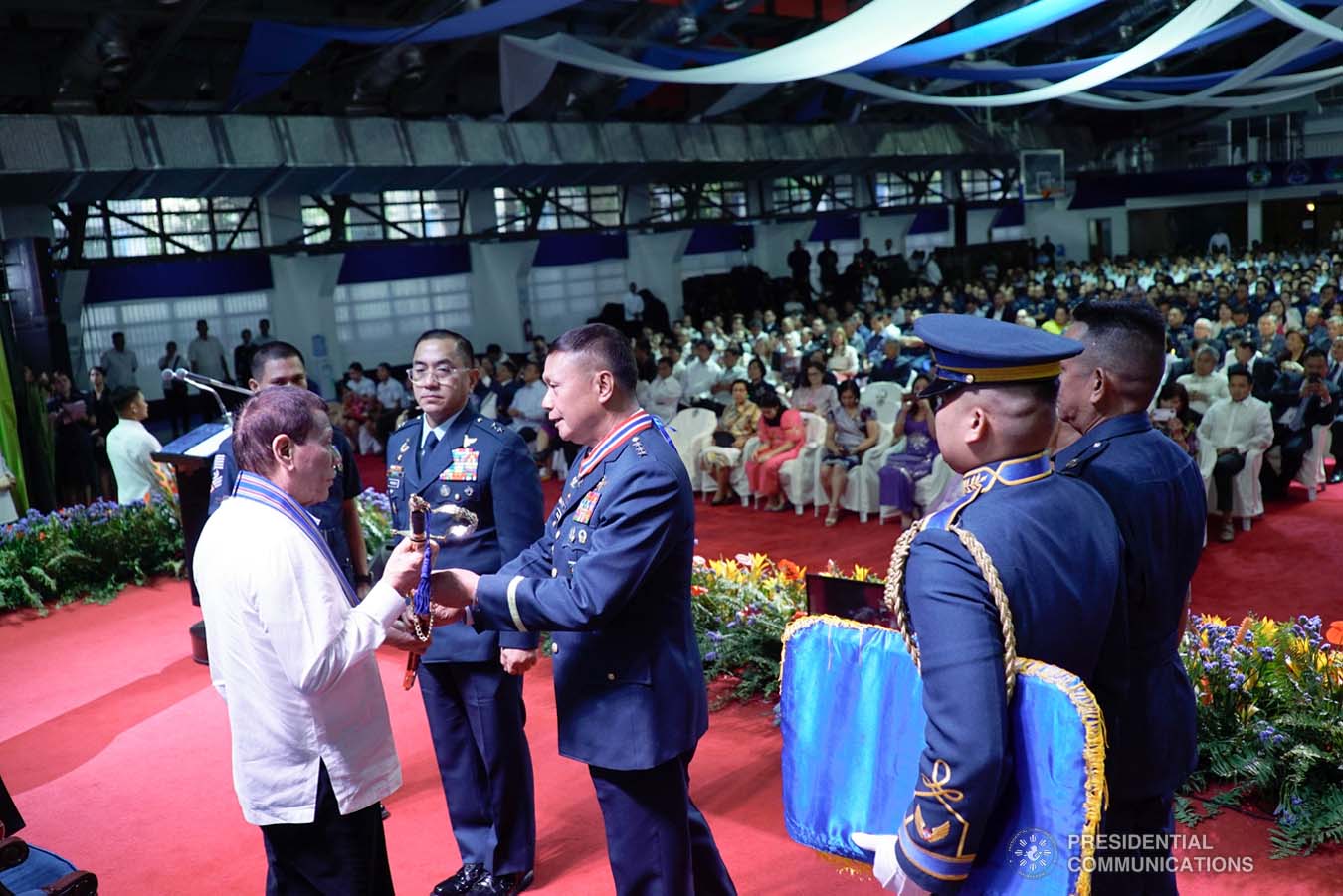 President Rodrigo Roa Duterte receives the command saber from outgoing Philippine Air Force (PAF) Commanding General Lieutenant General Rozzano Briguez during the PAF Change of Command ceremony at the Col. Jesus Villamor Air Base in Pasay City on January 16, 2020. KING RODRIGUEZ/PRESIDENTIAL PHOTO