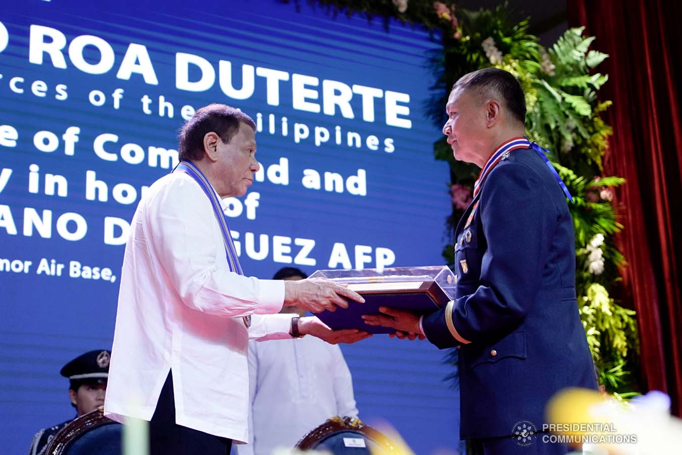 President Rodrigo Roa Duterte hands over an encased Philippine Flag to outgoing Philippine Air Force (PAF) Commanding General Lieutenant General Rozzano Briguez during the PAF Change of Command ceremony at the Col. Jesus Villamor Air Base in Pasay City on January 16, 2020. KING RODRIGUEZ/PRESIDENTIAL PHOTO