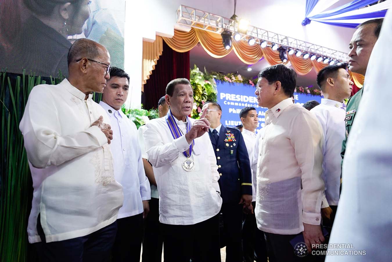 President Rodrigo Roa Duterte chats with Defense Secretary Delfin Lorenzana and Interior and Local Government Secretary Eduardo Año on the sidelines of the Philippine Air Force Change of Command ceremony at the Col. Jesus Villamor Air Base in Pasay City on January 16, 2020. KING RODRIGUEZ/PRESIDENTIAL PHOTO