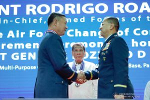 President Rodrigo Roa Duterte looks on as outgoing Philippine Air Force (PAF) Commanding General Lieutenant General Rozzano Briguez and incoming PAF Commanding General Major General Allen Paredes shake hands during the PAF Change of Command ceremony at the Col. Jesus Villamor Air Base in Pasay City on January 16, 2020. KING RODRIGUEZ/PRESIDENTIAL PHOTO