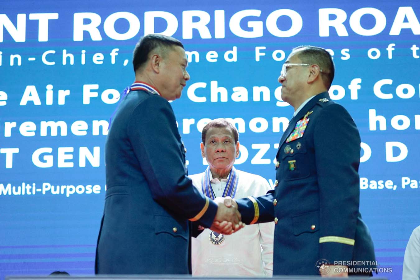 President Rodrigo Roa Duterte looks on as outgoing Philippine Air Force (PAF) Commanding General Lieutenant General Rozzano Briguez and incoming PAF Commanding General Major General Allen Paredes shake hands during the PAF Change of Command ceremony at the Col. Jesus Villamor Air Base in Pasay City on January 16, 2020. KING RODRIGUEZ/PRESIDENTIAL PHOTO