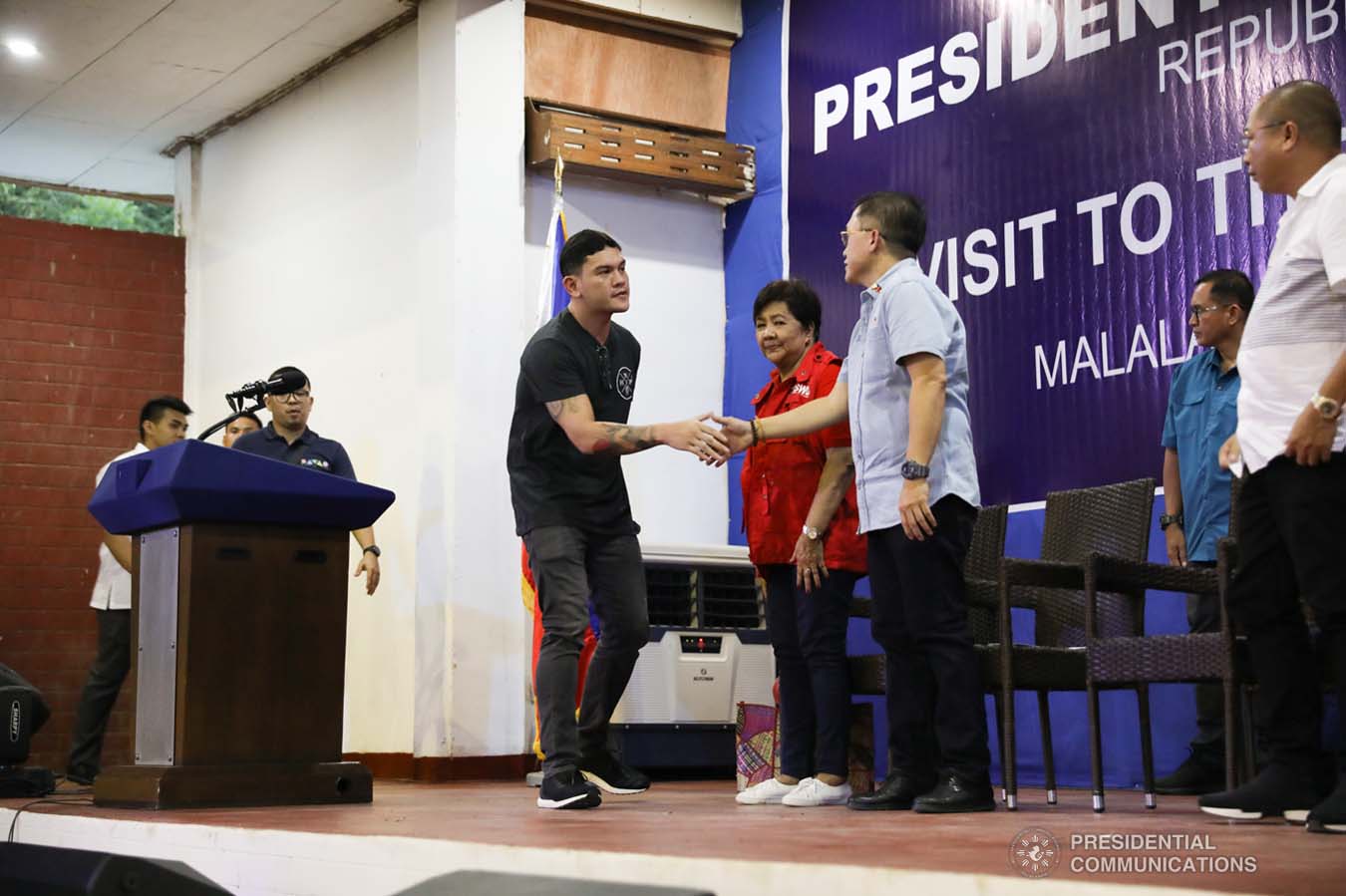 Davao City Vice Mayor Sebastian Duterte, who visited earthquake victims in Malalag, Davao del Sur on behalf of his father President Rodrigo Roa Duterte, greets Senator Christopher "Bong" Go at the Malalag Cultural and Sports Center on January 3, 2020.  KARL NORMAN ALONZO/PRESIDENTIAL PHOTO