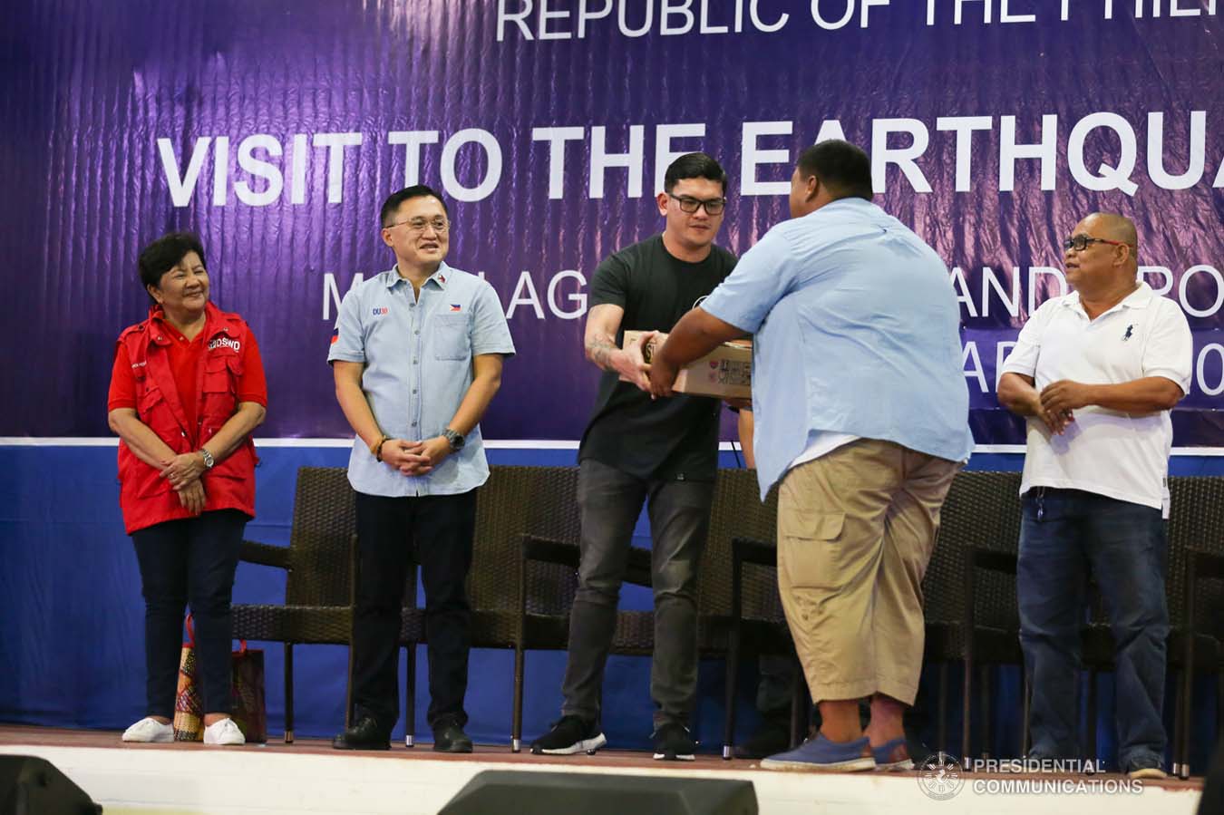 Davao City Vice Mayor Sebastian Duterte, who visited earthquake victims in Malalag, Davao del Sur on behalf of his father President Rodrigo Roa Duterte, leads the ceremonial distribution of family food packs at the Malalag Cultural and Sports Center on January 3, 2020. Assisting the President's son are Social Welfare and Development Undersecretary Luz Ilagan and Senator Christopher "Bong" Go. KARL NORMAN ALONZO/PRESIDENTIAL PHOTO